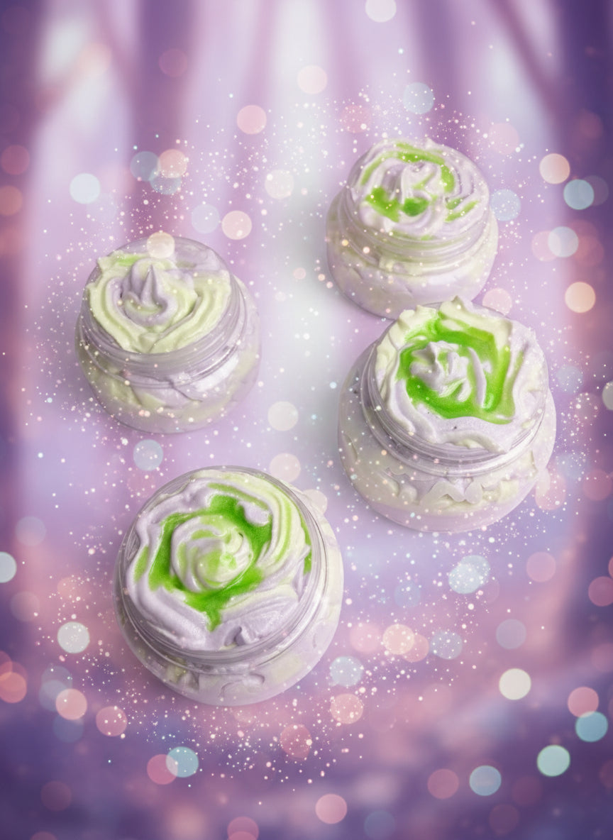 Green and white swirled dessert in clear containers on a green textured surface