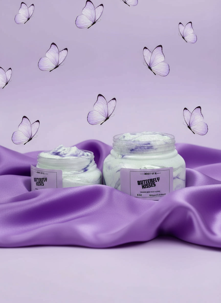 Two jars of 'Butterfly Kisses' body scrub on a light purple background